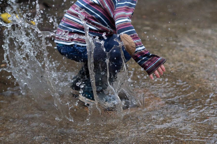kids splash in puddles